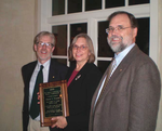 Cynthia Brock accepts the Lasker Distinguished Service Award on behalf of Phillip L. Walker